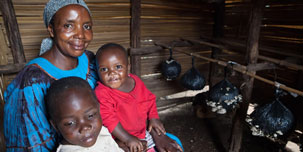 Photo of a mother sitting with her two children