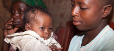 Photo of a woman holding a baby