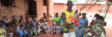 A facilitator leads a discussion with a women's group about couple communication, family planning and acting on reproductive intentions.