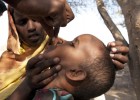 On July 29, 2011, a girl receives a de-worming tablet in the village of Malayley