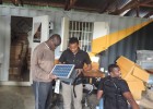 Steve Wasira, left, visits Off Grid Electric, a partner of the Power Africa sub-initiative, Beyond the Grid.