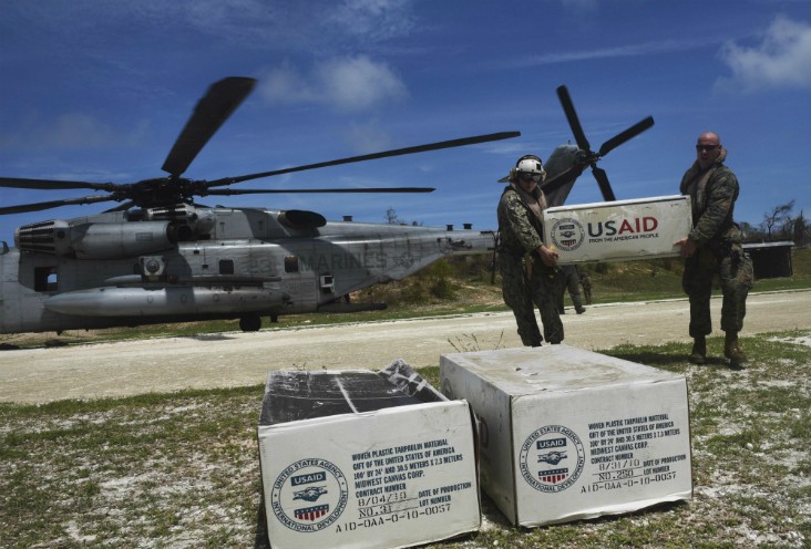 Aid is unloaded from a US helicopter in Jeremie, southwest of Port-au-Prince, Haiti