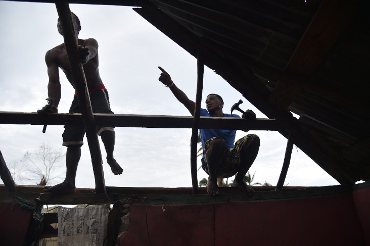  Residents repair their home after the passing of Hurricane Matthew, in Sous Roche in Les Cayes, Southwest Haiti