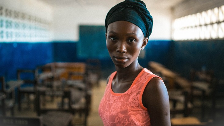 Advancing Youth Program (AYP) participant Hawa Ngfauah waits for her school to reopen.