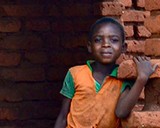 A boy eats lunch at a Morogoro village in Tanzania. © 2013 Jennifer Applegate, Courtesy of Photoshare