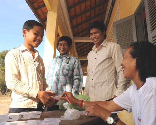 Sample collection containers are distributed at Pav Primary School in Rattanakiri.