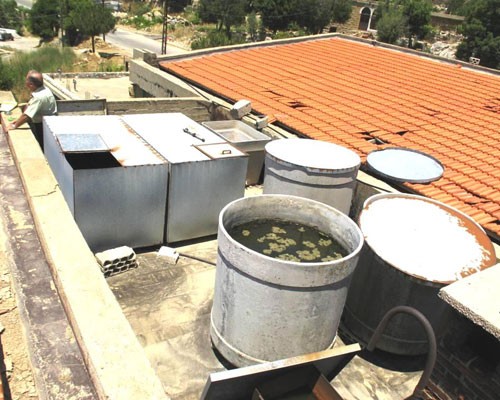 Water tank at Ehmej Intermediate School improperly covered and made of inappropriate material.  