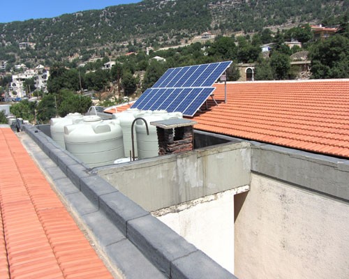 New water tanks at Ehmej Intermediate School installed by USAID. The solar panels for heating water were provided by the U.N. De