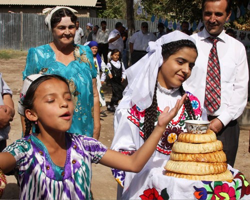 A child in Khatlon gives praise for the new drinking water system in her village.