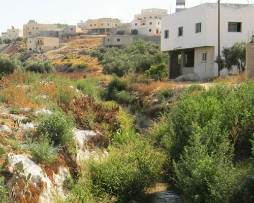  Just two months after USAID began working with stone companies to properly dispose of the slurry, this waterway was no longer b