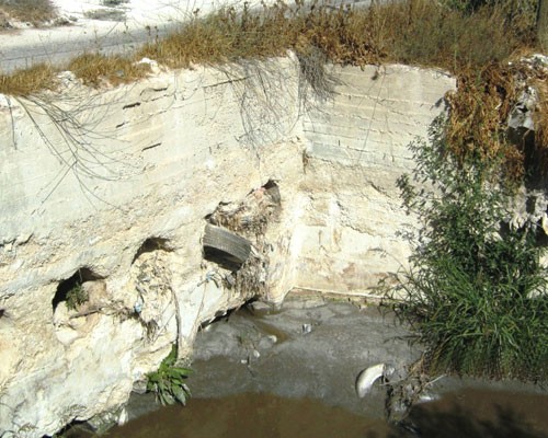 Below, just two months after USAID began working with stone companies to properly dispose of the slurry, this waterway was no lo