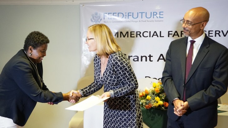 Ethiopian Agricultural Transformation Agency CEO Khalid Bomba watches as USAID Ethiopia Mission Director Leslie Reed presents a 