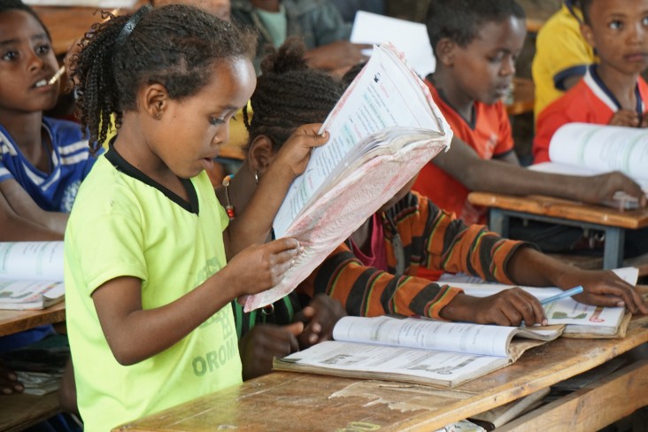 A student at the Soke Bukicha Primary School in Arsi Zone, Oromia Region, practices reading on a Oromiffa Textbook produced by U