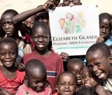 Young children holding sign.