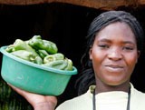 Woman with a bowl of peppers