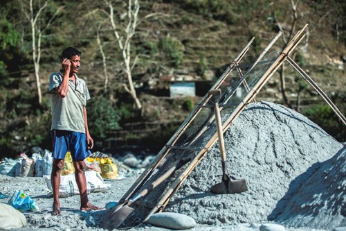 Employees at Sherchan’s stone quarry now receive notifications of their salary receipt through cell phones. 