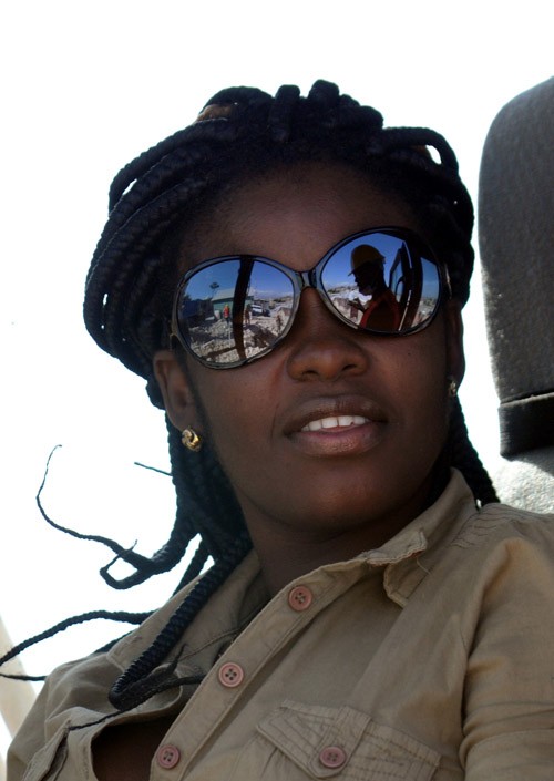 Judette Leurbours starts her day as a heavy machinery operator clearing rubble from the earthquake in Port-au-Prince, Haiti. Leu