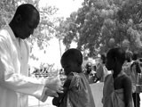 Doctor giving a shot to a child.