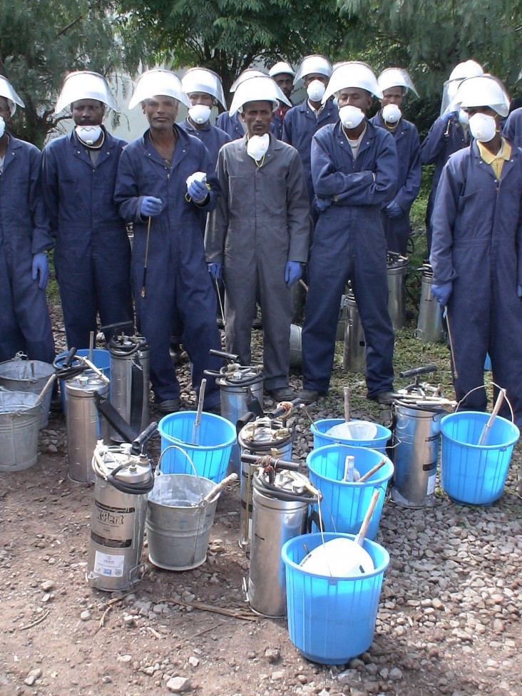 Men getting ready for indoor spraying  to prevent malaria