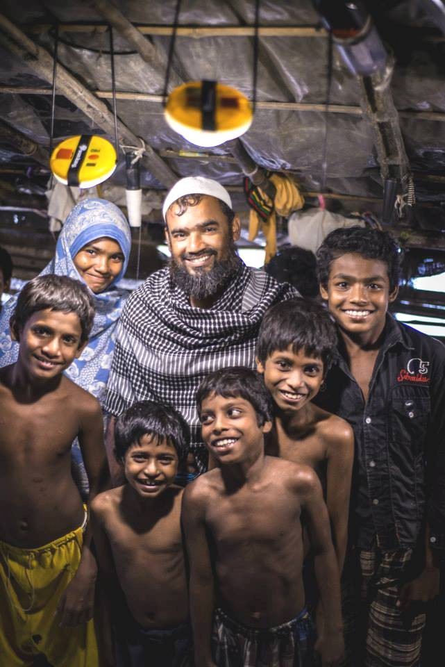 Asma Molla with her husband Jalal, their five sons, and their two solar lamps