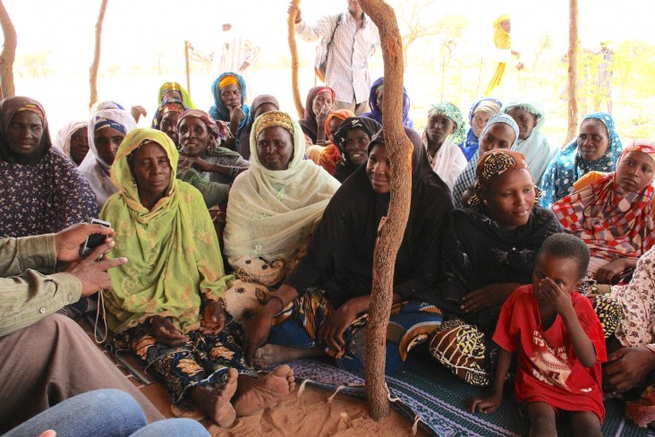 The Albarka women’s group meets in the shade near their oasis garden.