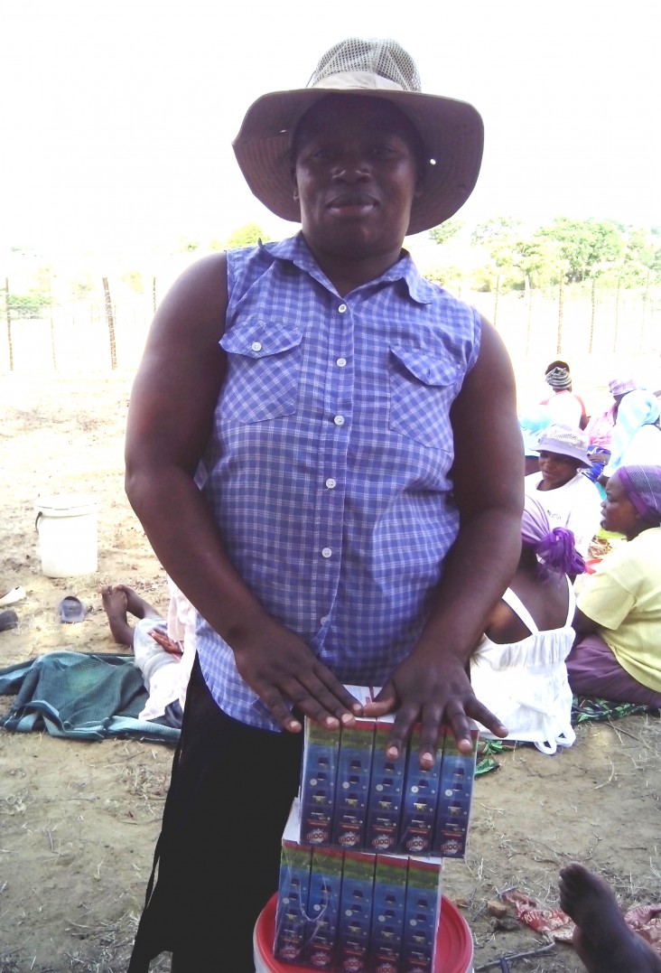 Respina Masarire displays the washing powder for sale at her microenterprise.