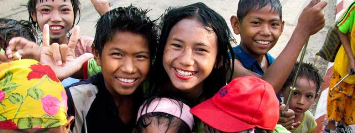 Two children smile at the camera.