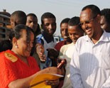 The head of a female sex worker cooperative conducts a street session in Ethiopia on how to use a condom properly.