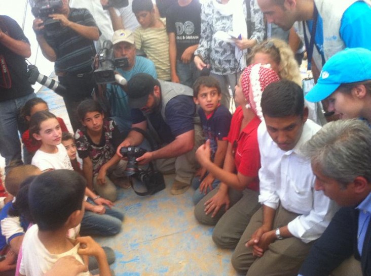 Administrator Shah speaks to Syrian refugee children during his visit to the Za'atri refugee camp in Jordan. 