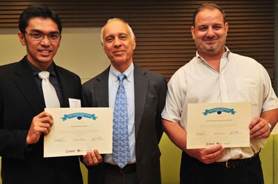 USAID RDMA Director Michael Yates (center) with Mobile Solutions M4D Contest Award Winners Javier Sola of the Open Institute, fi