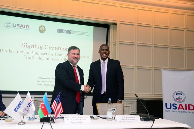 Ambassador Chahtahtinsky (left) and Chargé d’Affaires Hogan (right) shake hands after signing the declaration.