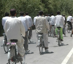 Every day over 400 bicyclists ride over the Pul-e-Alam road south of Kabul. Many of the riders are students going to-and-from sc