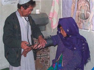 A young woman receives treatment at a USAID-funded Basic Health Center in Bamyan Province, Afghanistan.