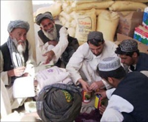 Afghan farmers cash in seed and fertilizer vouchers as part of a USAID-assisted poppy eradication program.