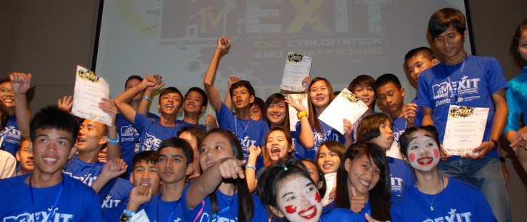 Students from Burma and Thailand celebrate after performing anti-trafficking awareness scenes and graduating from the first-ever