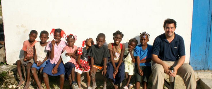 USAID's Lee Cohen with students of the Morency Primary School near Les Cayes, Haiti 