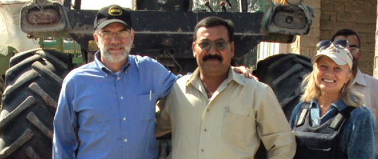 Michael Maxey, senior economic development adviser in USAID's Iraq Reconstruction Office, left, visits a project site for the In