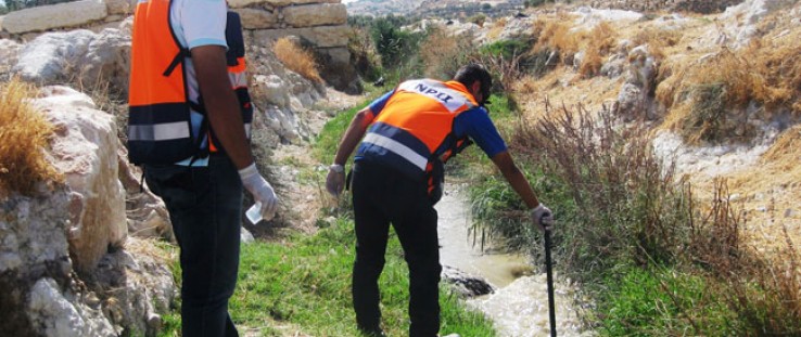 USAID project staff regularly test the water downstream to check for traces of slurry.