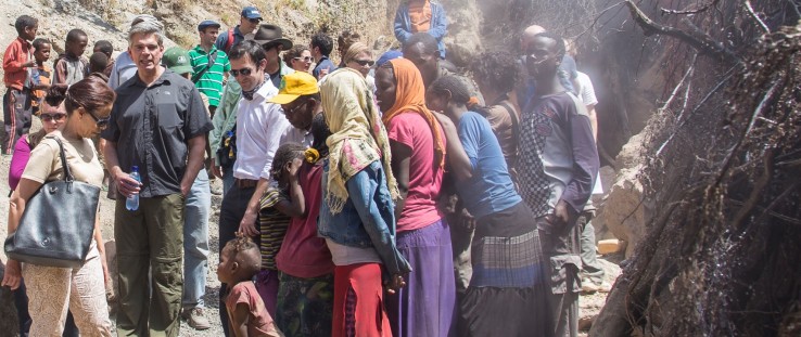 Girls fetch condensed water from the steam in Ethiopia's Corbetti Caldera as they speak with representatives of Power Africa.