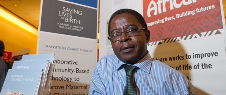 Christopher Mfornyam, of Africare, mans his organization's display at USAID's third Saving Lives at Birth event.