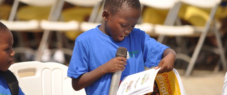 A child reads to the audience during Ghana’s reading festival in Cape Coast.