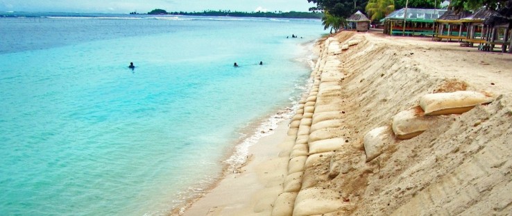 Resistant to punctures and ultraviolet rays, these sturdy, multiple-ply bags are filled with sand.