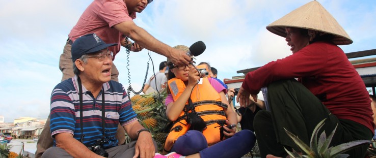 Mekong Matters journalists interview a floating market seller about changes to the water caused by upstream development and climate change.