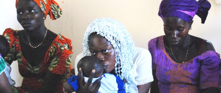 New mothers listen intently to guidance from the community health team in Koulouck Mbada about caring for their newborn infants.