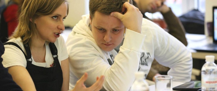 Judges confer after the presentation of a prototype at a hackathon in Ukraine in February 2015.