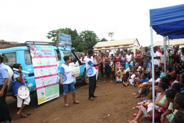 Community health volunteers explain family planning methods to members of the community