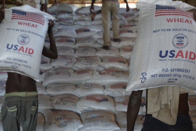 Workers stack sacks of wheat in a USAID warehouse in Dire Dawa, one of four primary distribution points in Ethiopia. USAID provides the food through its Joint Emergency Operation managed by Catholic Relief Services.