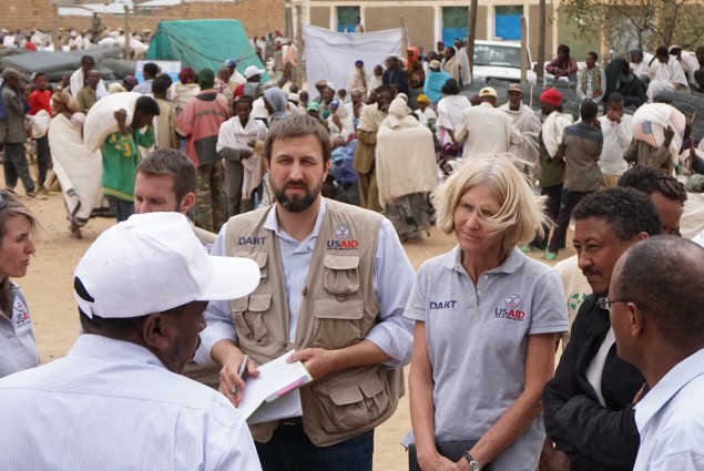 While visiting a food distribution site in Hawzien, USAID partners Relief Society of Tigray and Catholic Relief Services briefed USAID Office of Foreign Disaster Assistance Director Jeremy Konydnyk and Disaster Assistance Response Team (DART) Leader Kate Farnsworth about how the drought is affecting food distribution in the region.