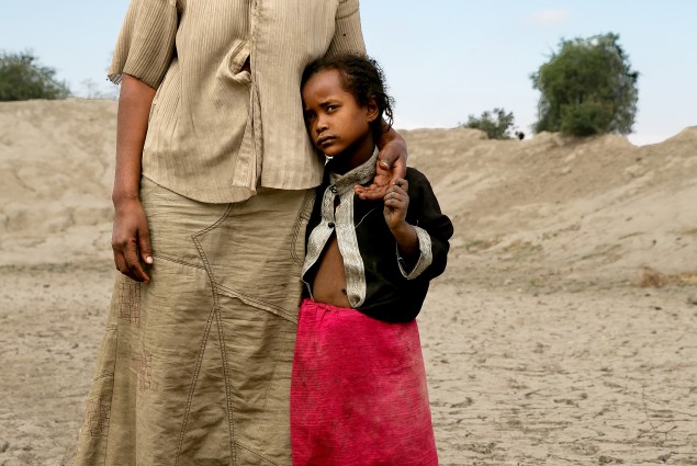 Badoo Fukura, 28, stands at the bottom of a basin that used to be the community watering hole. It served about 30 different families here, near the small town of Aje, south of the capital Addis Ababa. In normal years, after the rains the water here lasts for six months. The water only lasted two months in 2015. The watering hole went dry in October.