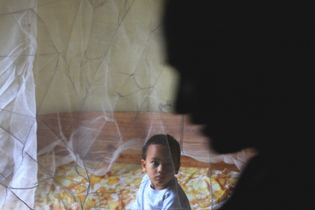 child under a bednet in Ranomafana